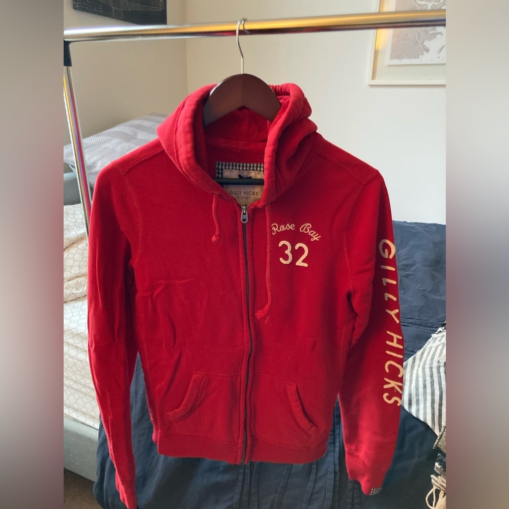 Red hooded sweatshirt. Gilly Hicks.
